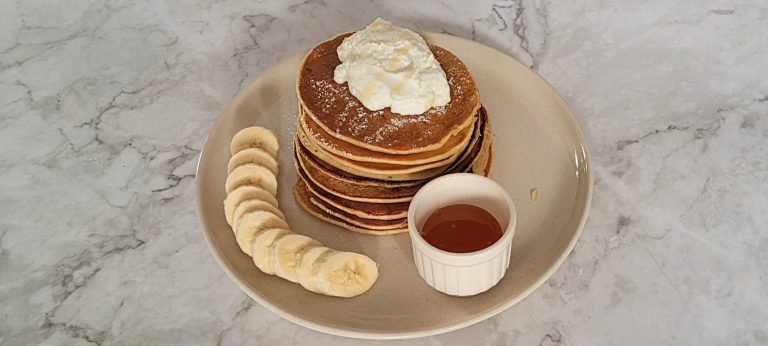 healthy banana pancakes made with whole wheat flour served on a plate