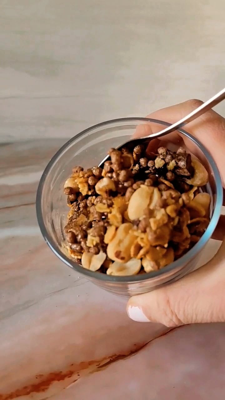 high protein crunchy granola with soy crispies, peanuts and chocolate in a bowl