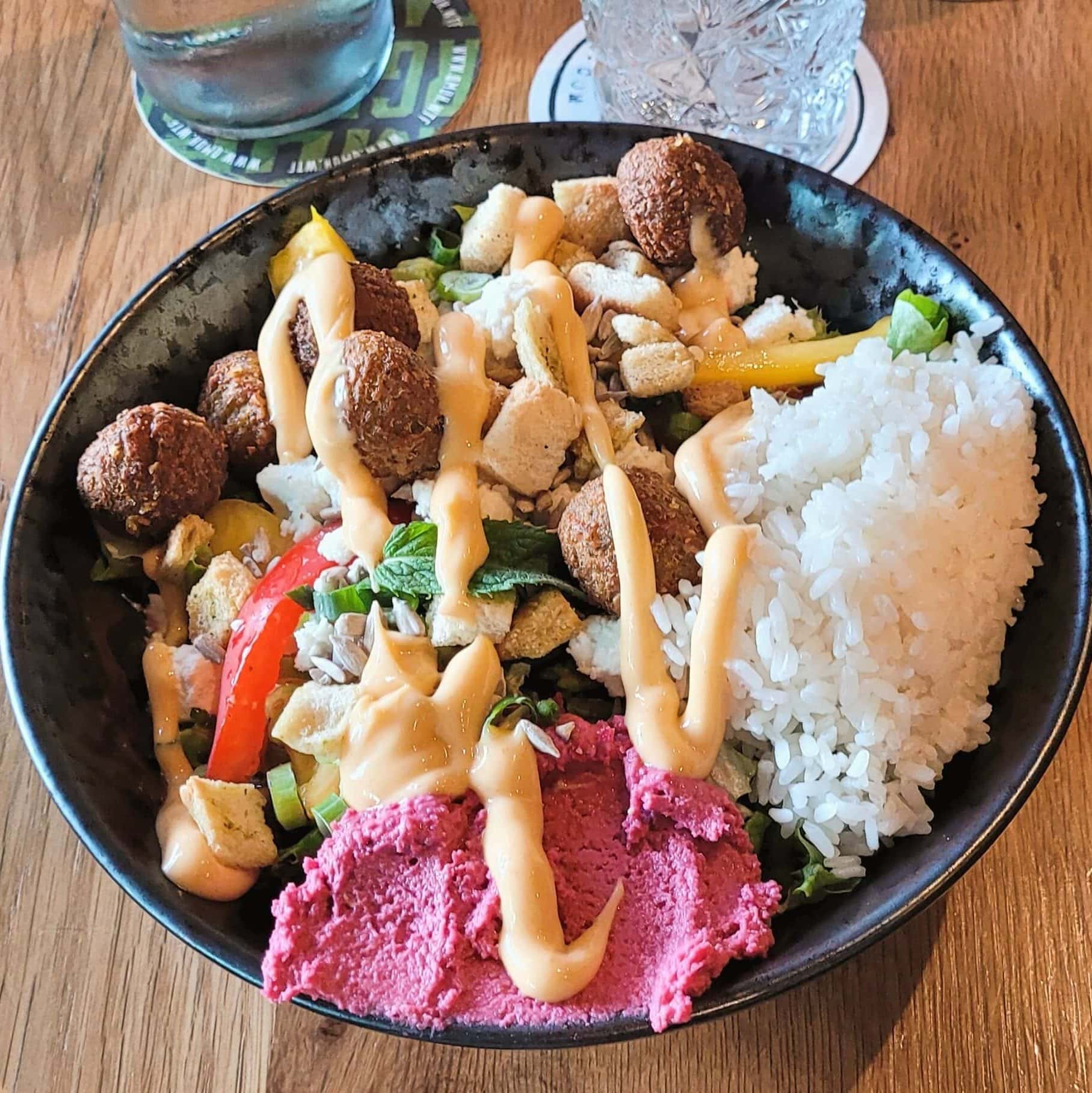 rice bowl with vegetables and protein rich toppings balanced meal