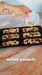 Easy Homemade Protein Bars topped with dates and penuts