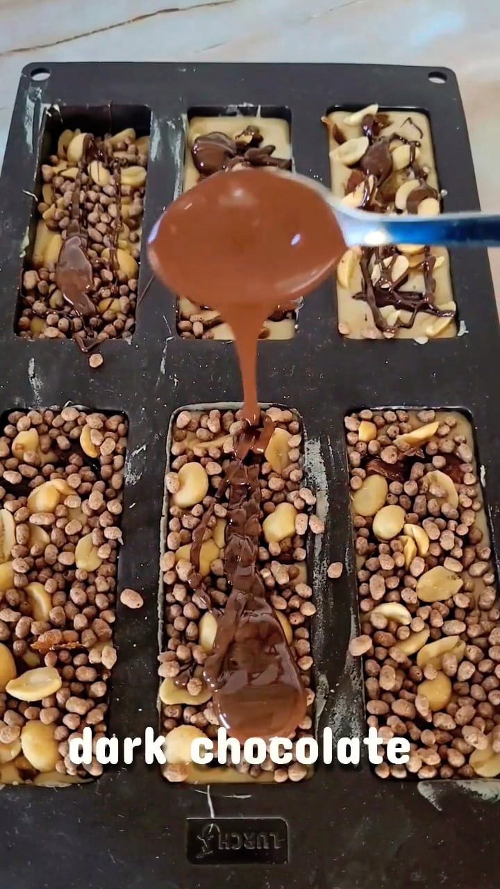 melted dar chocolate topped on Easy Homemade Protein Bars