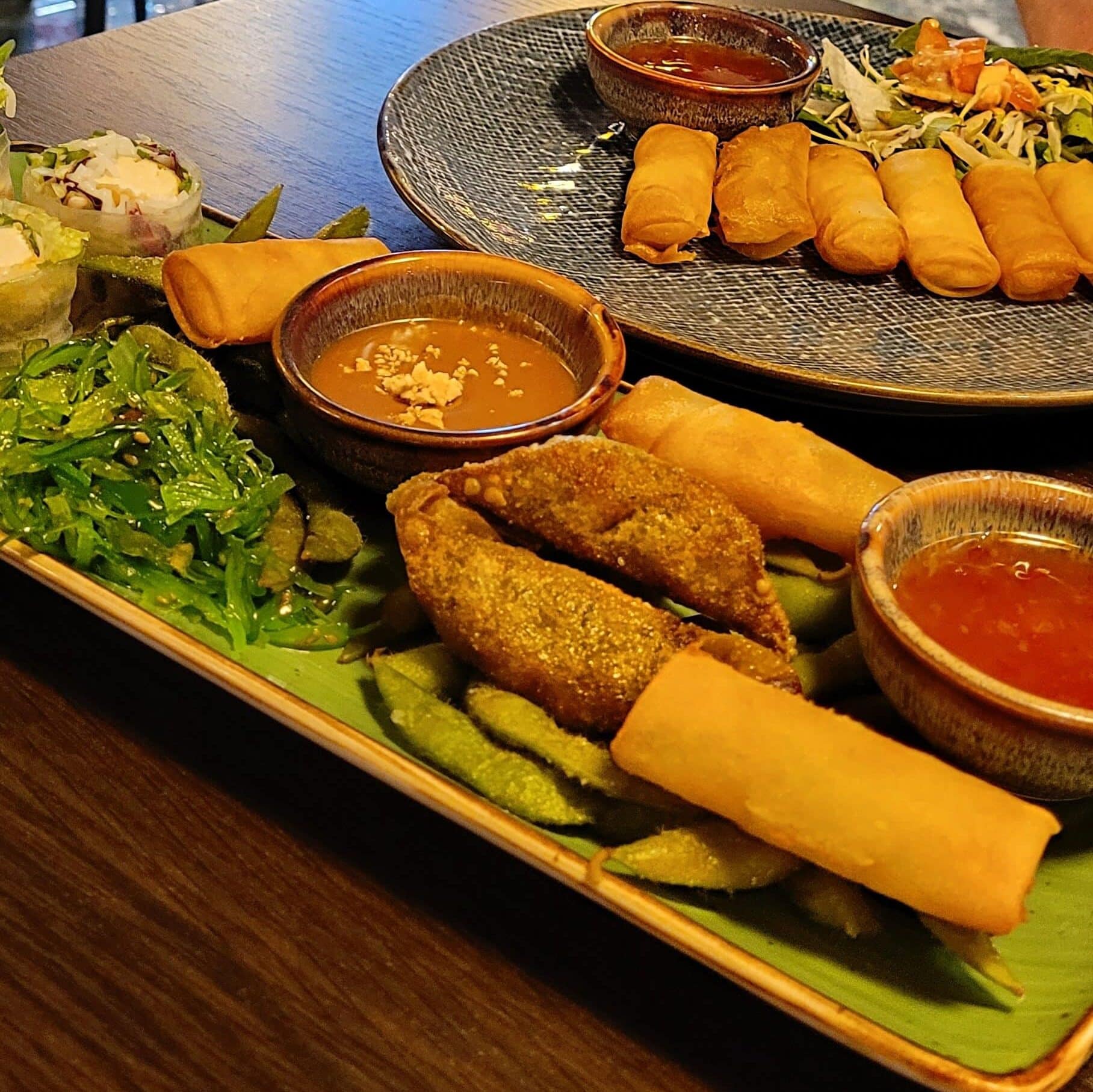 shared snack plate with vegetables and small dishes variety healthy eating out