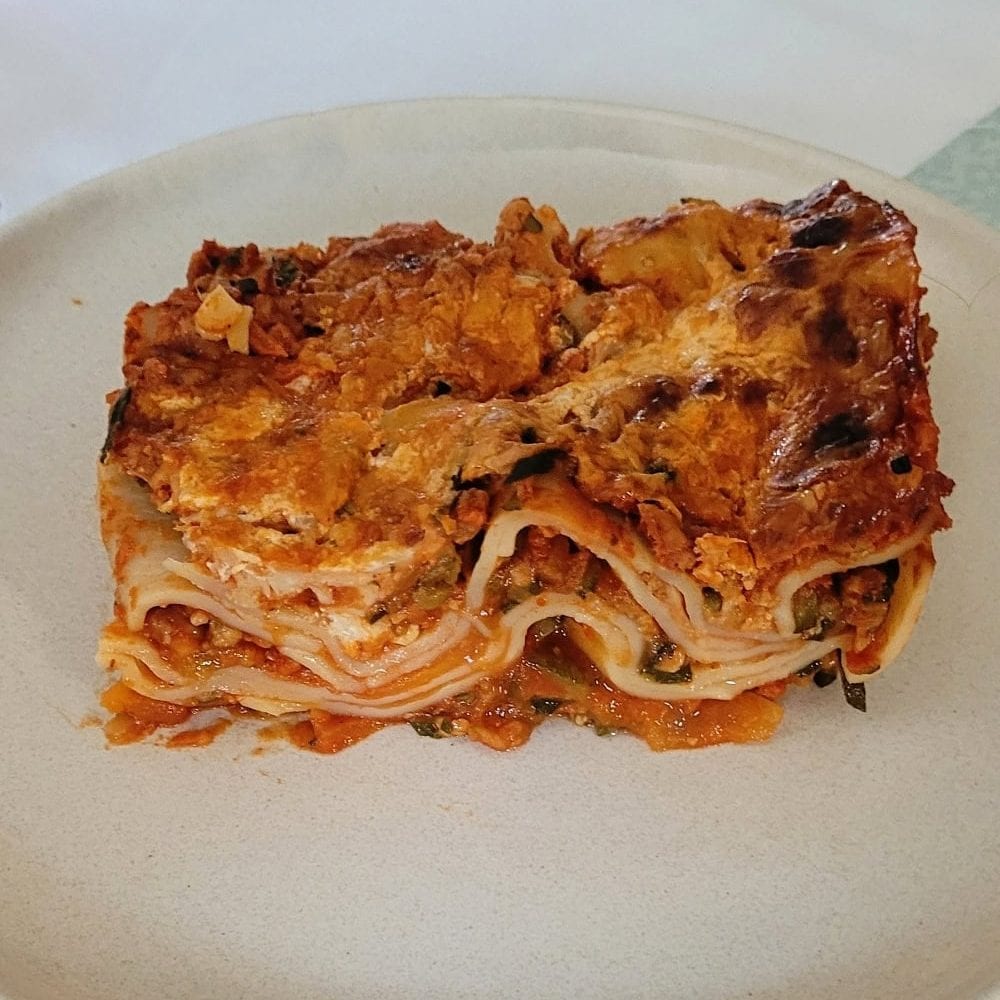 Amazinng vegetarian lasagna with vegan ground meat and fresh vegetables.