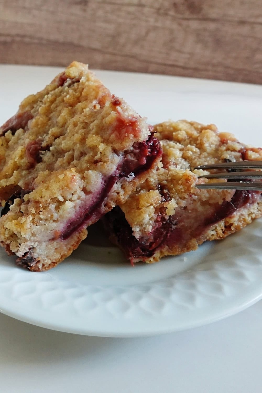 Delicious homemade plum crumble cake with a golden crust and fruity filling.