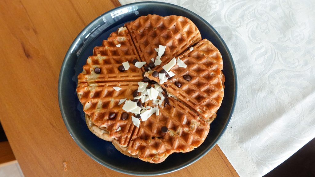 Golden brown healthy banana waffles made with ripe bananas and whole wheat flour.