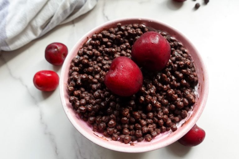 Vegan high protein chocolate dessert with fresh berries and magic shell topping.
