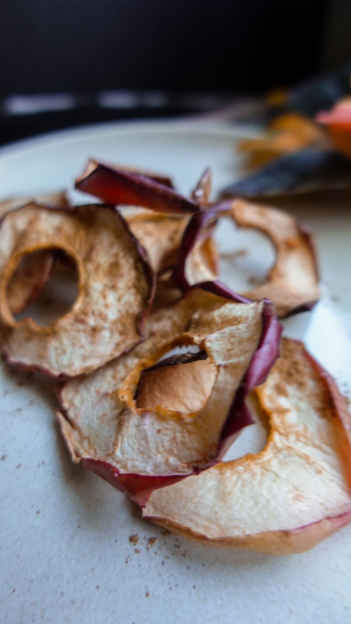 Homemade crispy apple chips prepared in an air fryer for healthy snacking.